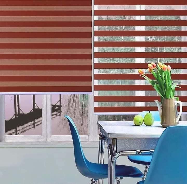 Red zebra blinds in a dining room